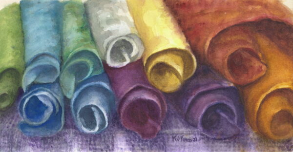 Rolls of felt yarn in a rainbow of colors