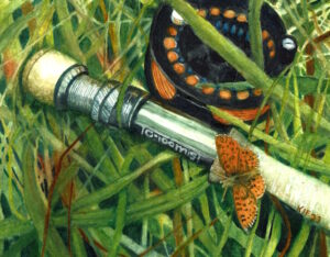 A fly rod and reel with orange line and an orange butterfly on the handle